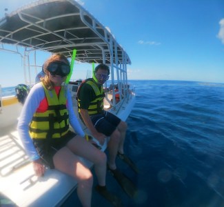 a person riding on the back of a boat